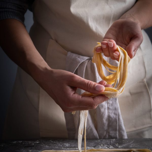 chef-arranging-raw-pasta